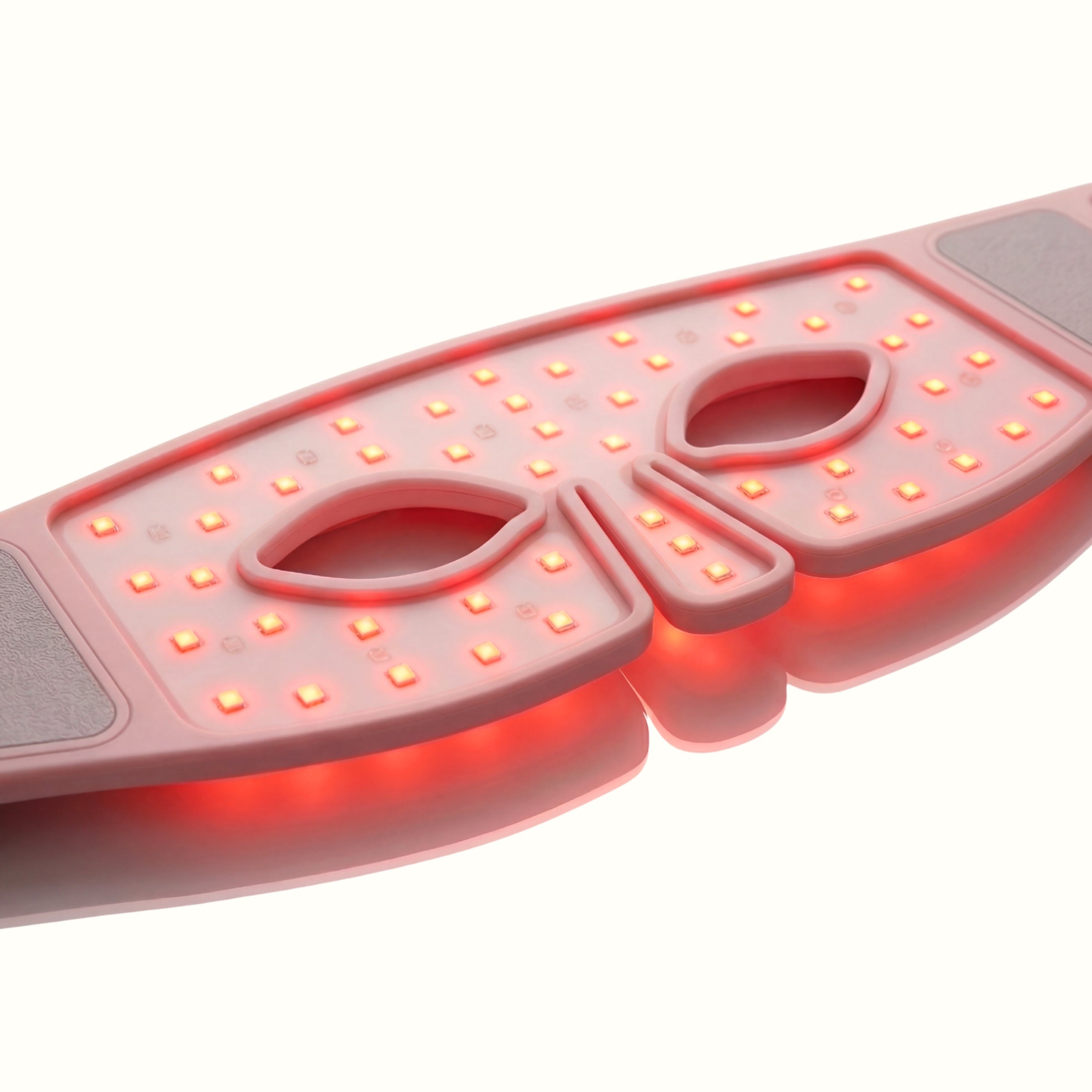 Gros plan du Masque LED yeux Auréa™ allumé, LED de luminothérapie rouge sur le contour des yeux